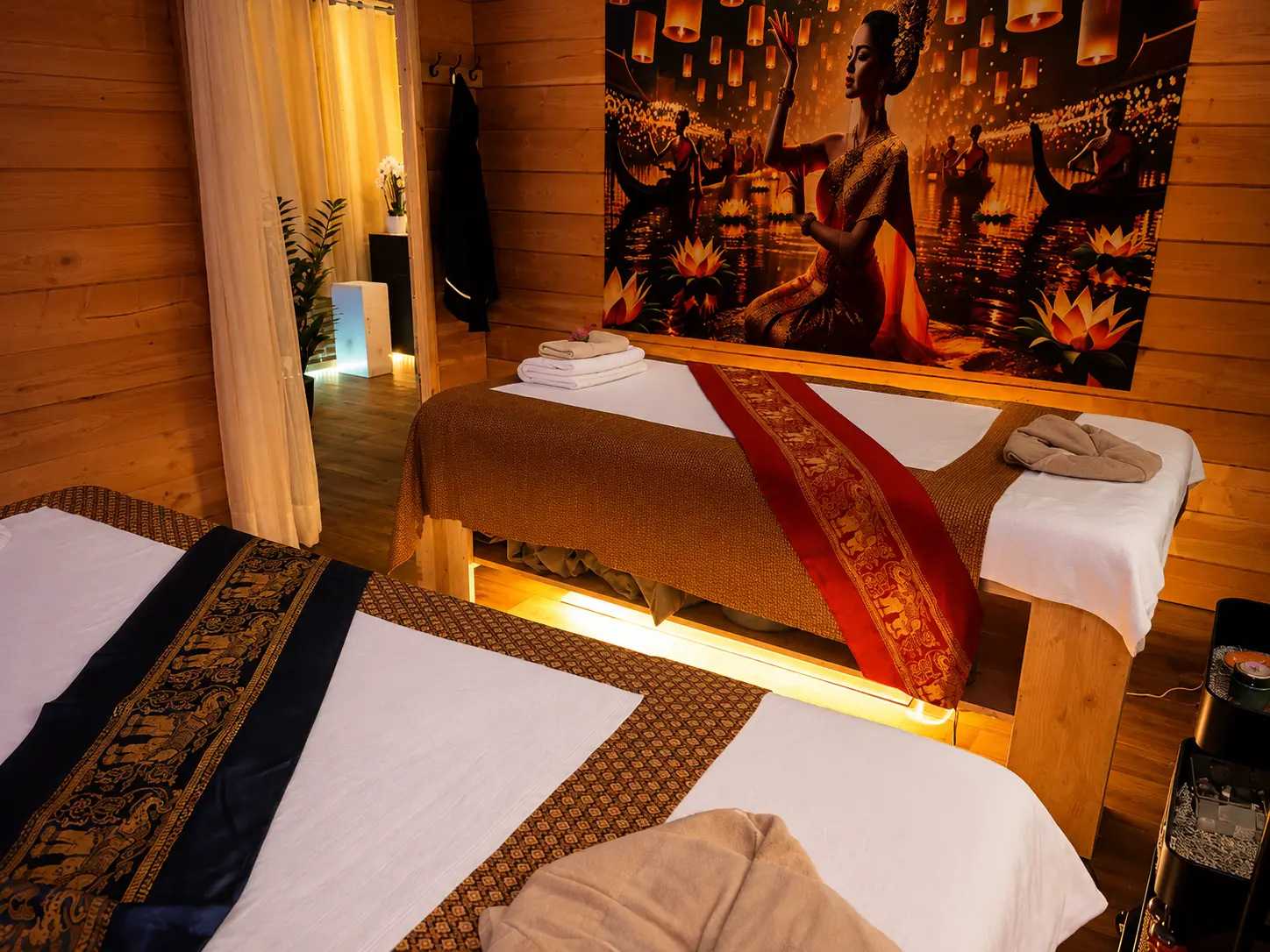 Warm Thai massage room with two treatment beds